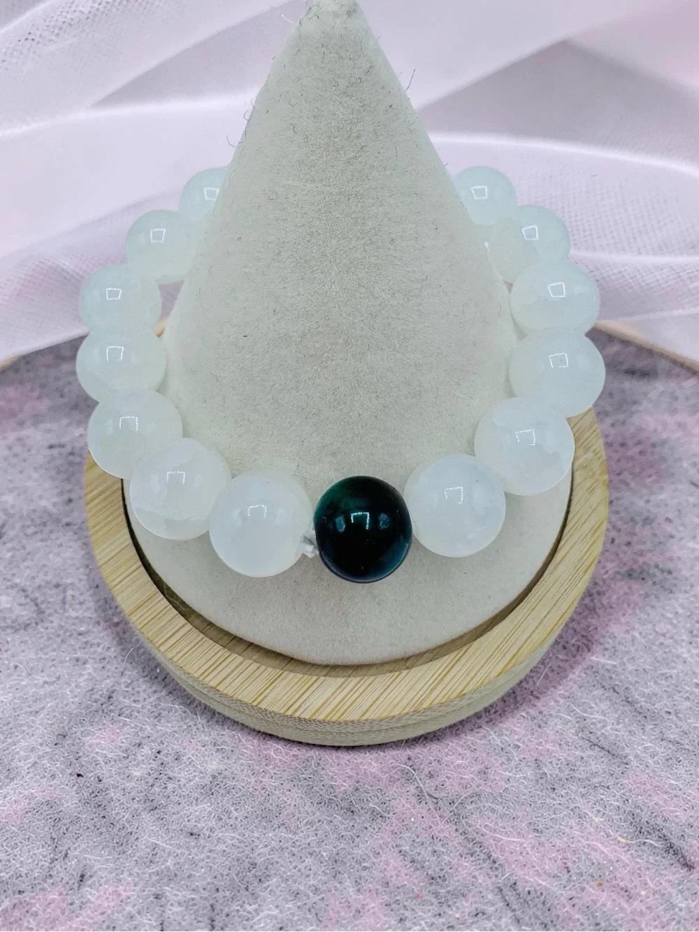 White Beaded Bracelet with Single Dark Accent Bead